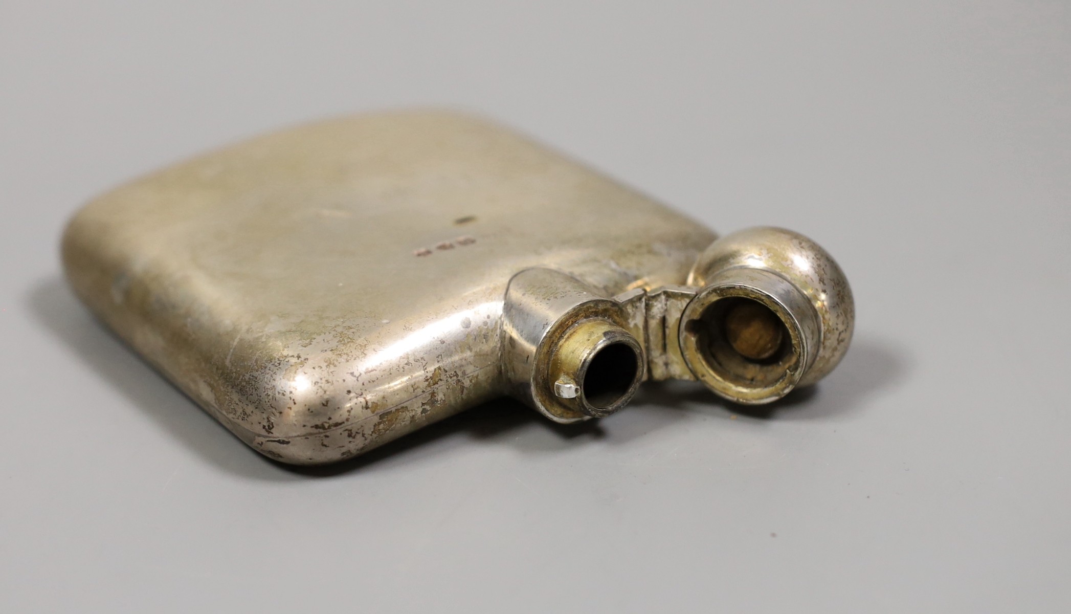 A late Victorian silver hip flask, Stokes & Ireland Ltd, Chester, 1897, 11.4cm, with engraved initials.